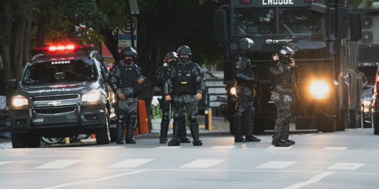 police standing on road during night time