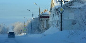 Snow covered building against sky